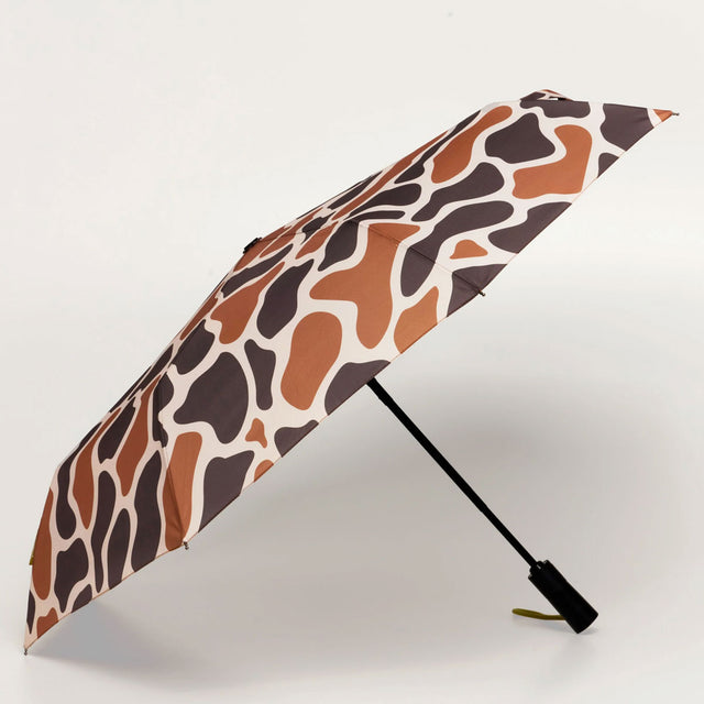 Umbrella with taupe and brown pattern on a light background