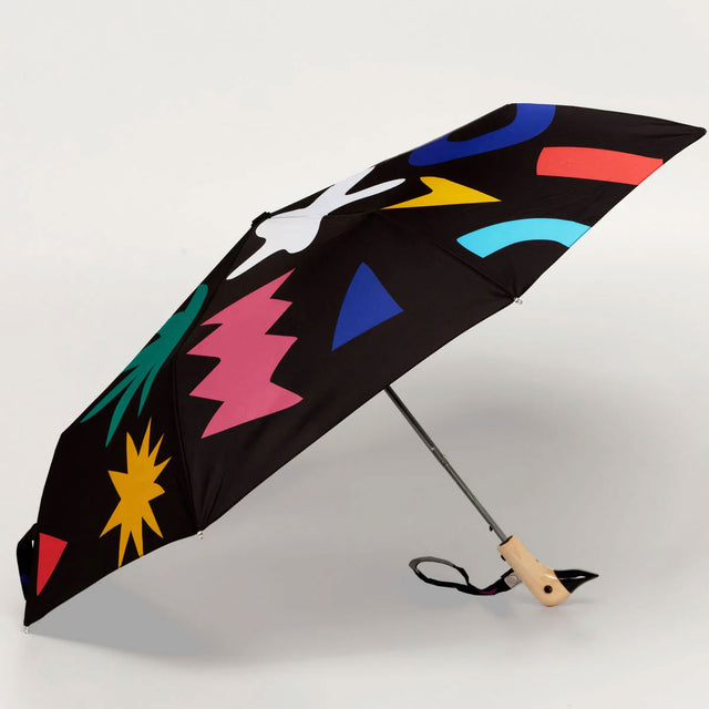 Colorful umbrella with geometric patterns on a white background