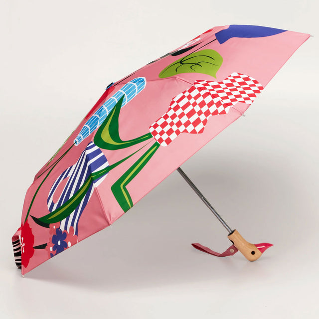 Colorful umbrella with a floral design and a wooden duckhead carved handle