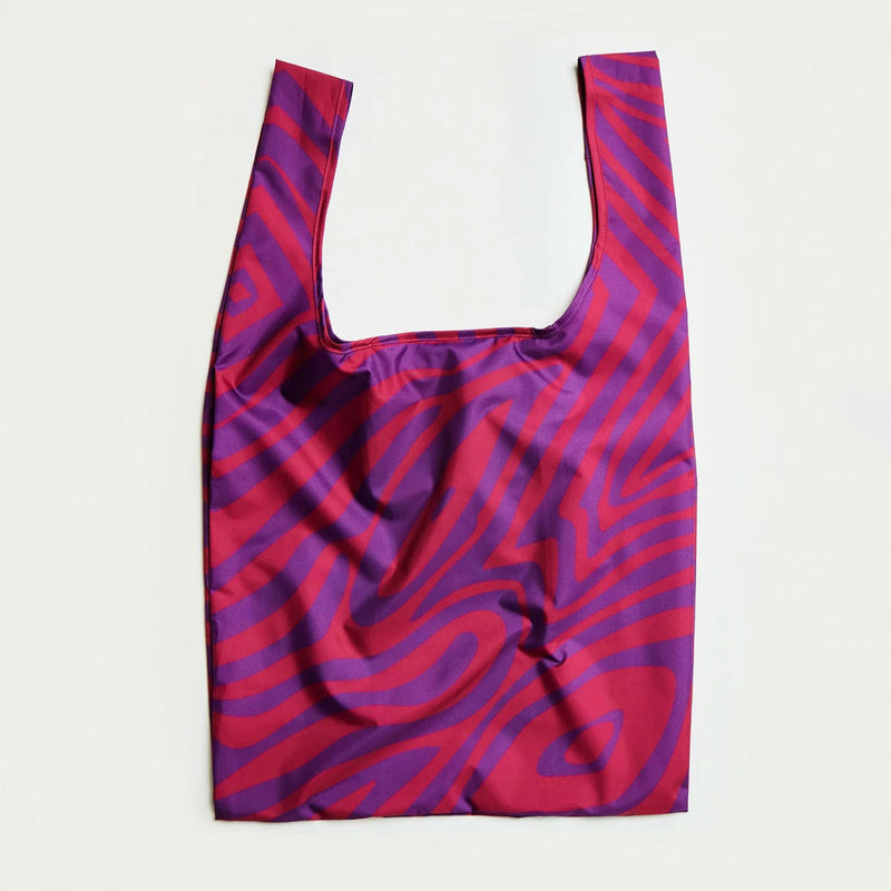Reusable shopping bag with purple and pink pattern on a white background